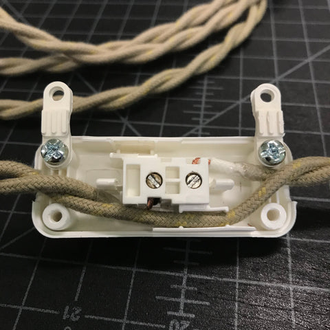 vintage slim switch with twisted pair wire attached to mechanism