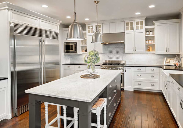 layered lighting example in kitchen with pendants downlights