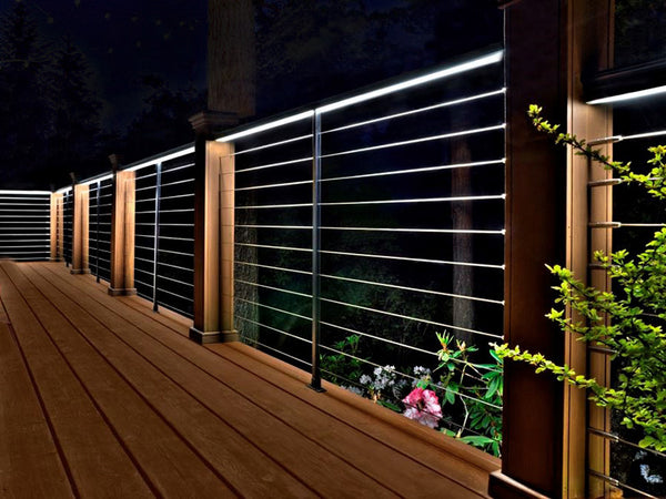 outdoor decking with led strip lighting installed in the railings 