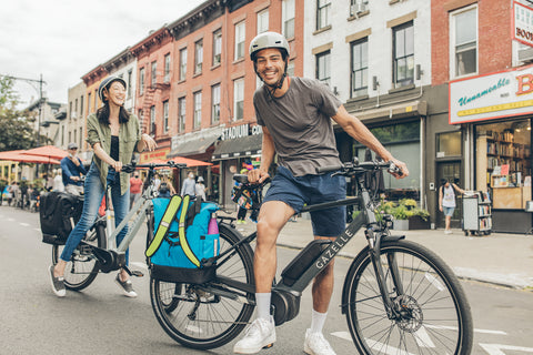 Two people on bikes with panniers - panniers for commuting