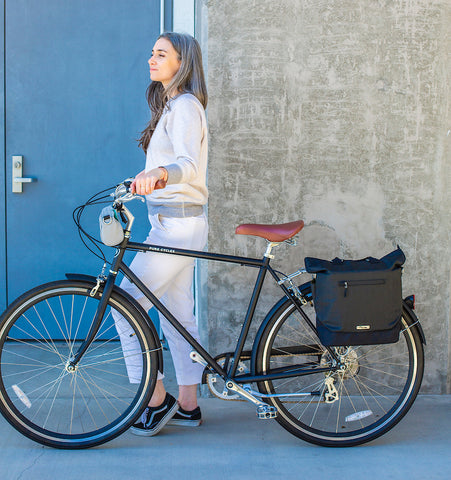 Woman with bike - panniers for commuting