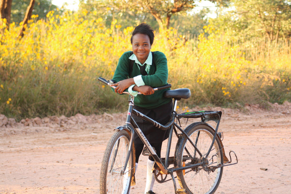 Student on bicycle donated by World Bicycle Relief in Africa