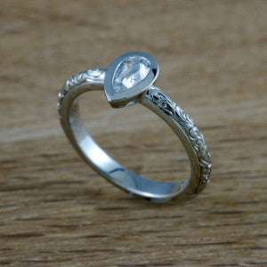 Pear shaped, hand engraved diamond engagement ring from  Era Design Vancouver.