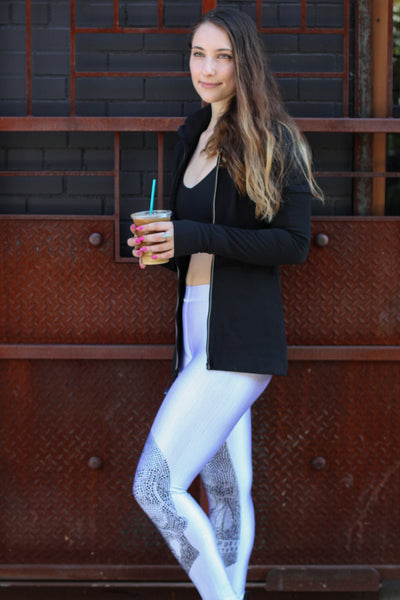 Julia Malacoff, SHAPE Magazine Senior Fashion Editor, wears Terez White Crystal Skull Leggings