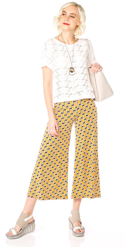 yellow cropped trousers