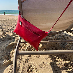 Cherry red crossbody in the beach