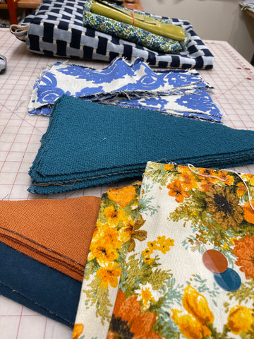 fabrics planned for metier totes on a table