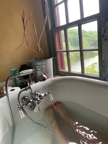 bath in a claw foot tub overlooking the Hudson river