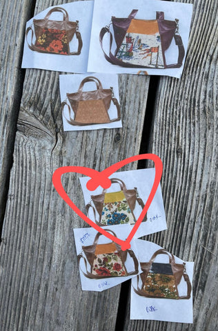 cut outs of bags on deck with a heart circled on the best bag