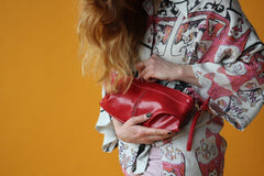 red pleated clutch