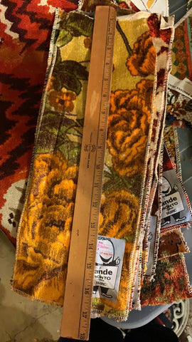 stack of vintage velvet upholstery samples with ruler