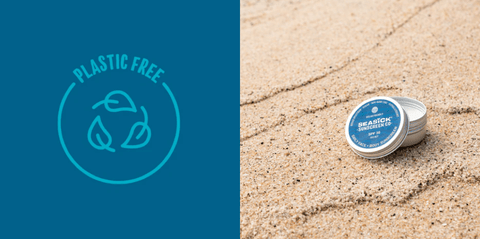 Plastic free logo on left and tin of Seasick Sunscreen sitting on the sand