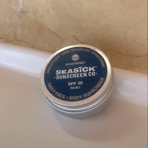 tin of Seasick Sunscreen sitting on bathroom counter