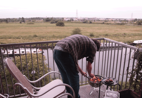 Marc boasting his balcony BBQ and barges