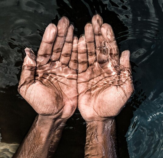 Hands under water