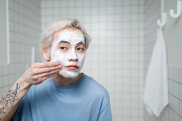 Man washing his face