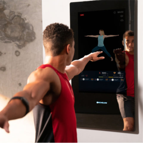 Man using Echelon Fitness reflect touch for his workout in his home gym