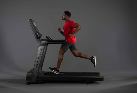 Man running on Matrix treadmill for home gym