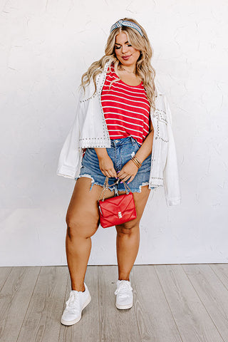 Modish african american woman in red shirt and jeans skirt with jacket  posed at clothes store. It's time for shopping. 10433227 Stock Photo at  Vecteezy