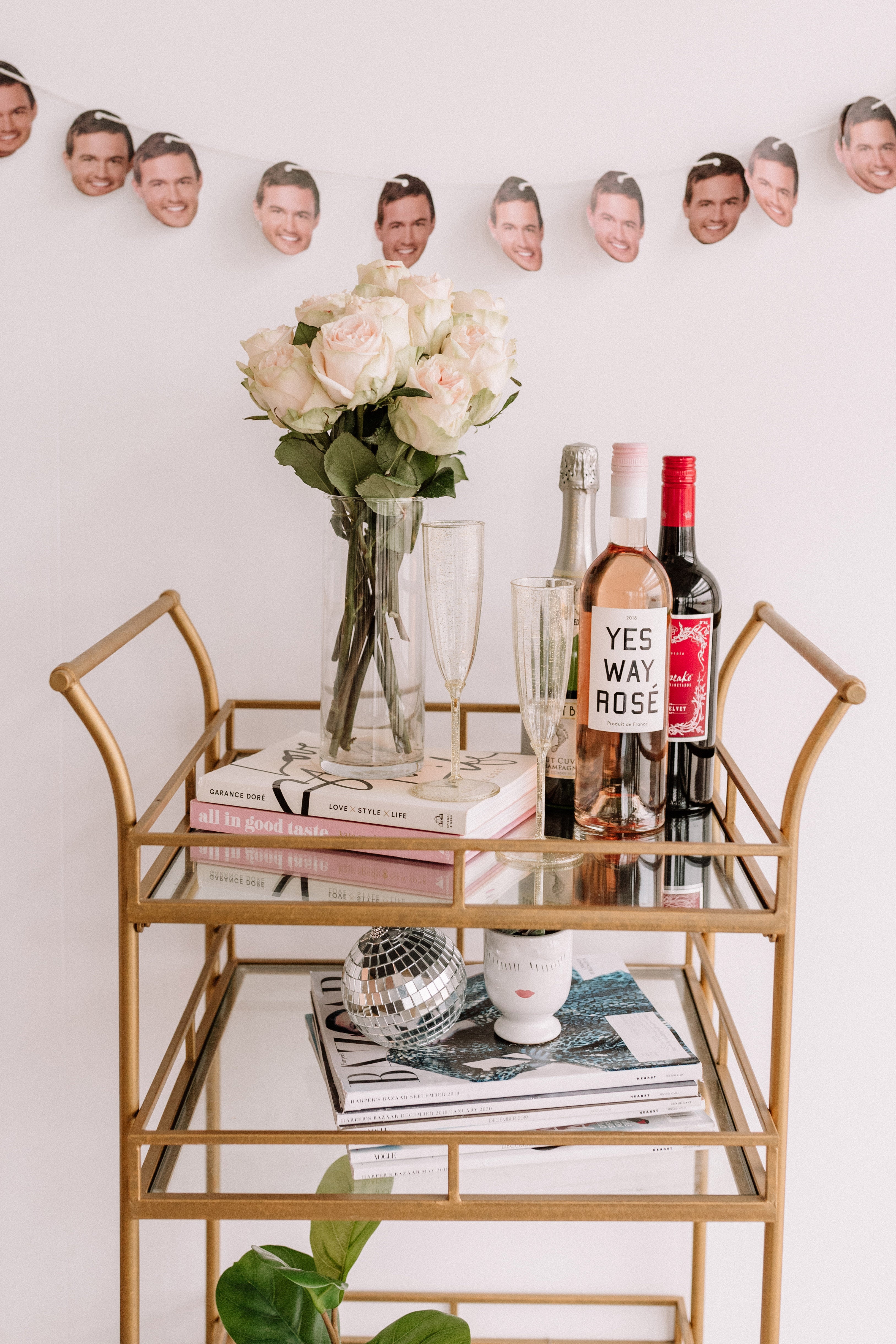 Tray with flowers, a book and beverages