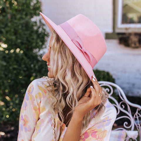 Your spring wardrobe won't be complete with our adorable light pink 'Swore To Forever' fedora featuring lightweight felt material, a 3.5-inch brim, and a matching accent band! Cranial Circumference: 23 inches Length: 14.5 inches Width:13.5 inches Height: 4.5 inches
