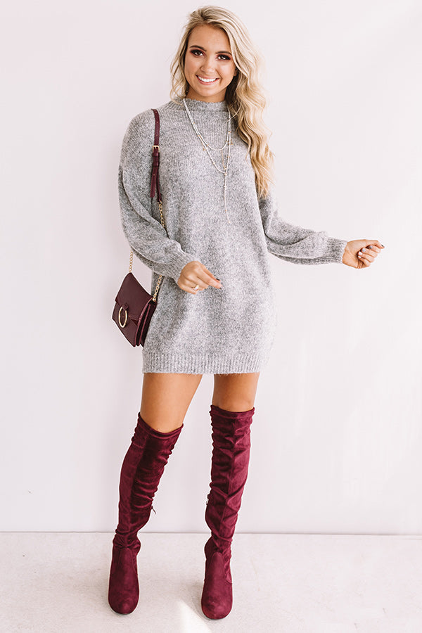 sweater dress and high boots
