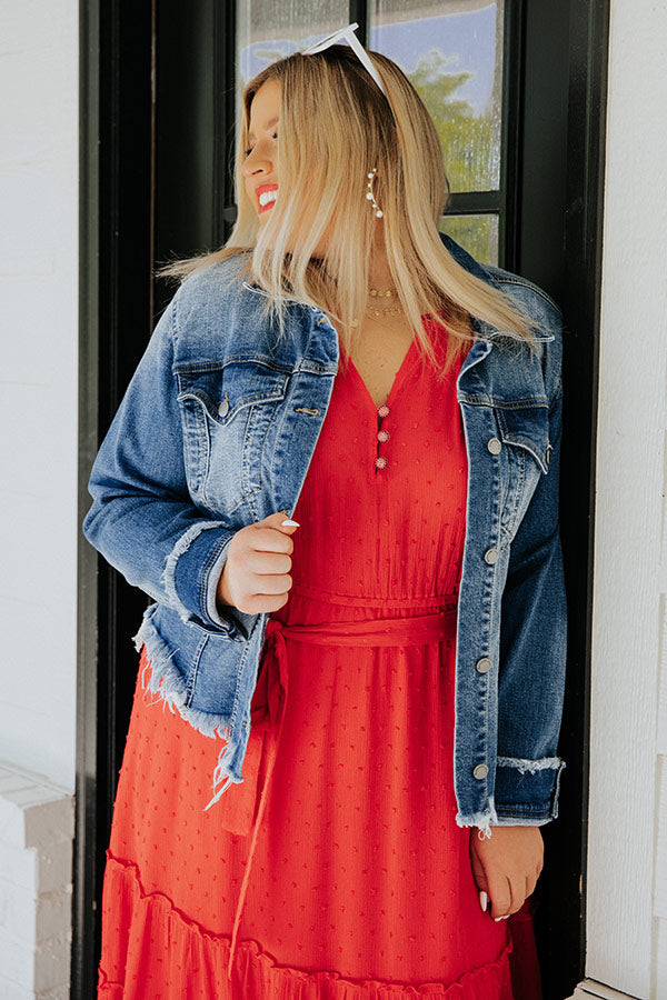 A modern young woman in red dress, denim jacket and red cap, posing on the  street of the city with glass windows reflecting trees in background. Beaut  Stock Photo - Alamy