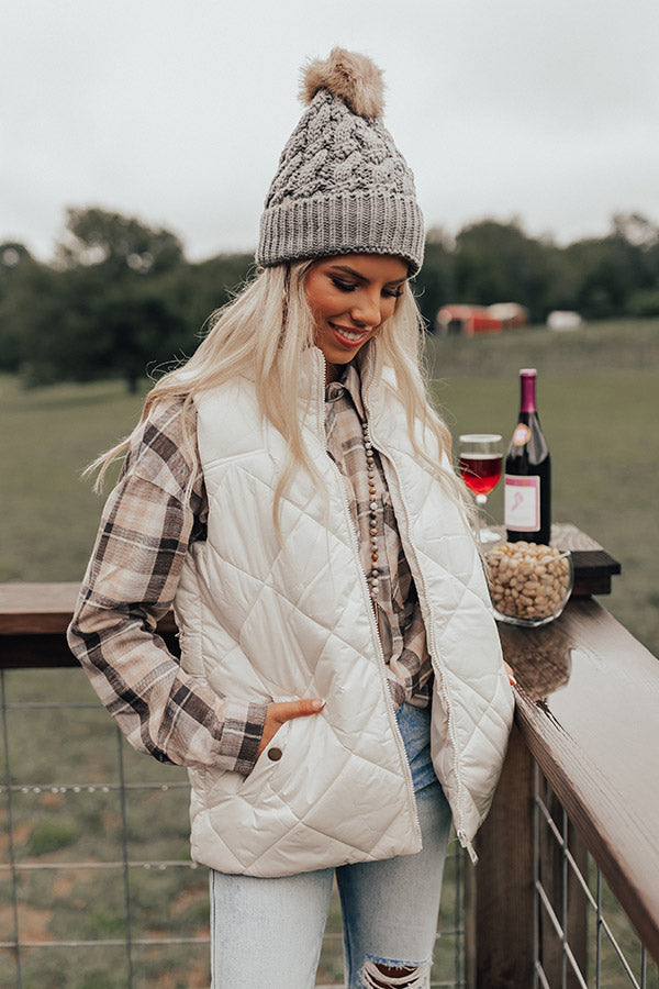 casual fall weekend outfit preppy quilted vest cable knit sweater