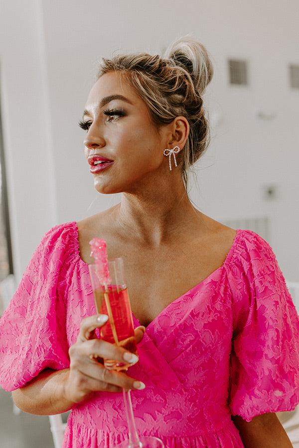 Amy Julliette Lefévre is seen wearing golden hoop earrings; a pink... News  Photo - Getty Images