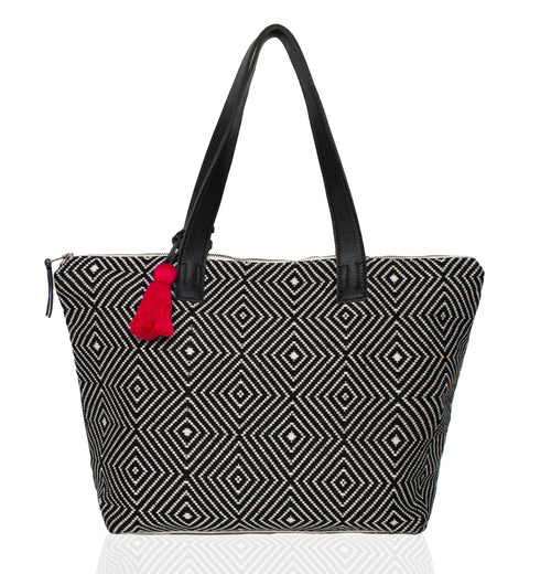 Hand woven artisan Estella tote on a white background