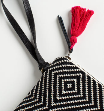 Hand woven artisan Mini Lily Wristlet bag cropped to fit bag, zipper, red tassel, and strap