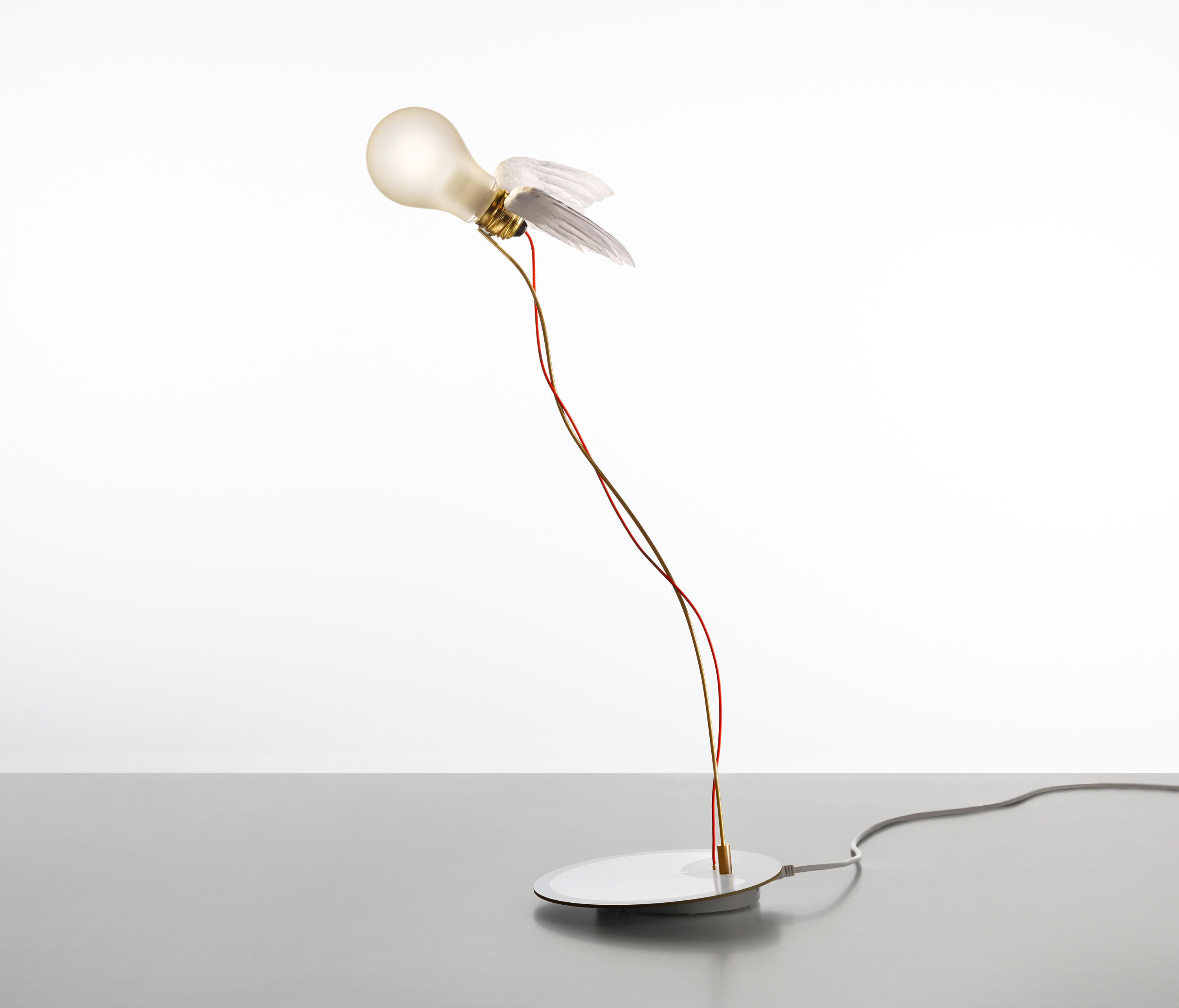 A desk lamp in the form of a bulb flying through the air. Is it the angel of light?