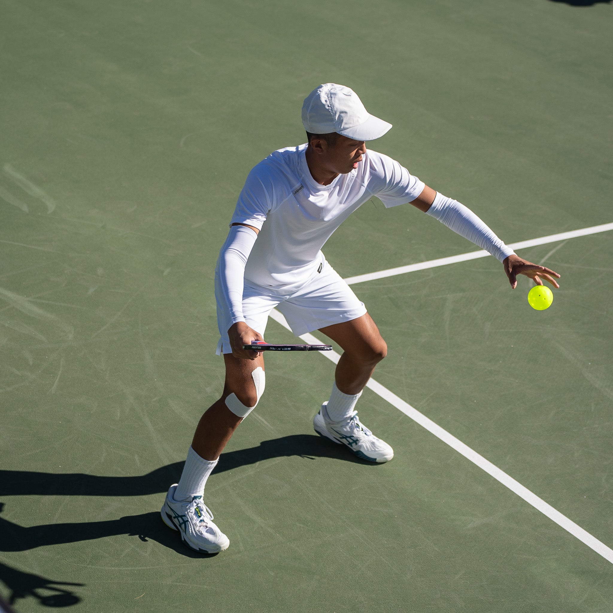 Quang Duong imparts spin on the pickleball.