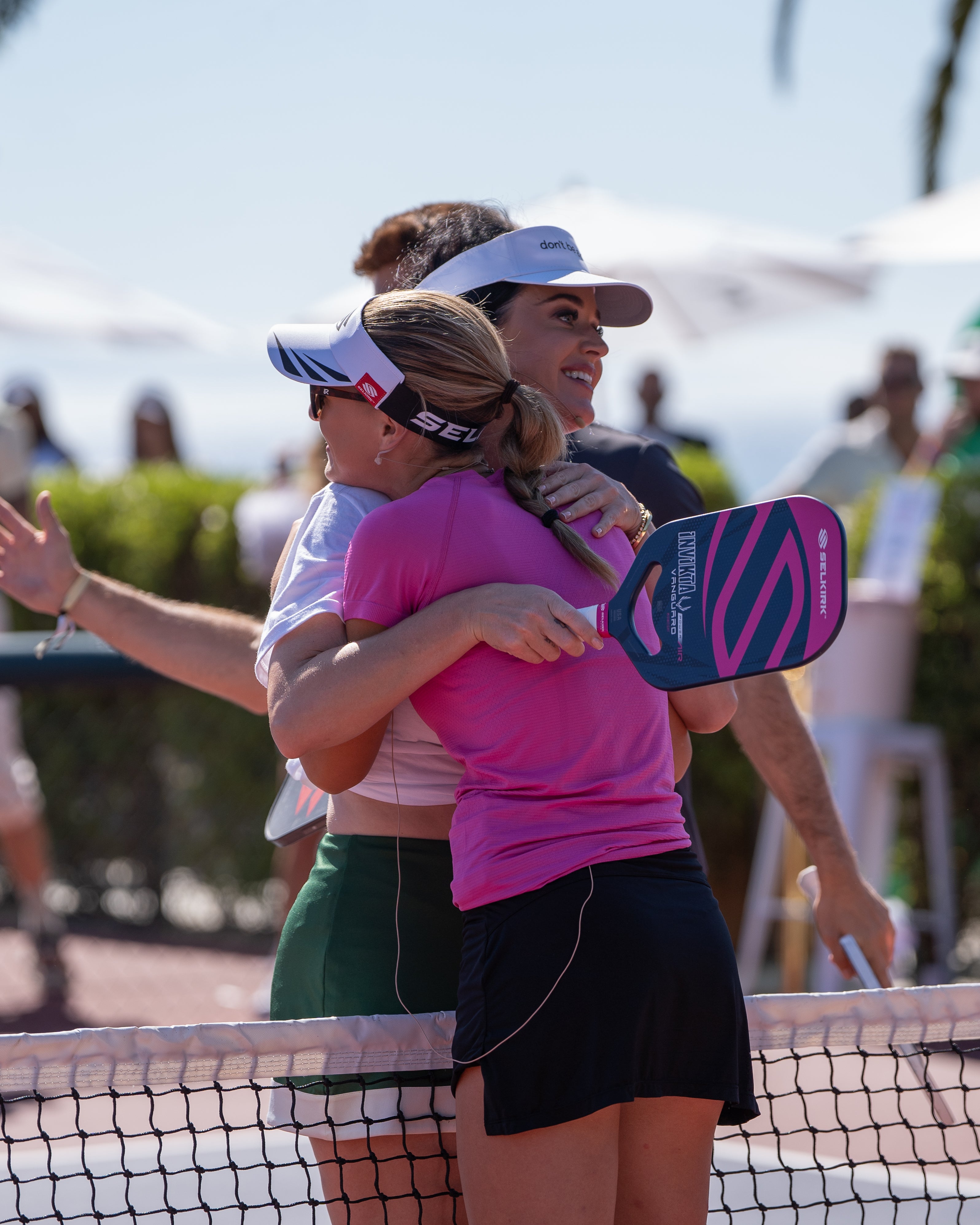 Selkirk Sport athlete Maggie Brascia hugs Katy Perry after playing an exhibition pickleball match