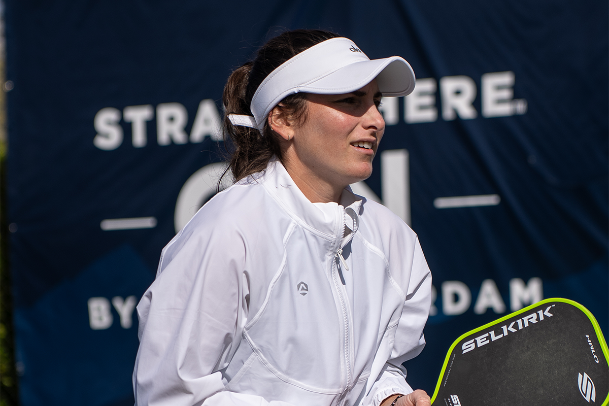 Professional pickleball player, Rachel Rohrabacher, with the SLK Halo Paddle - Green in hand.