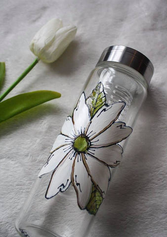 White flower on glass bottle