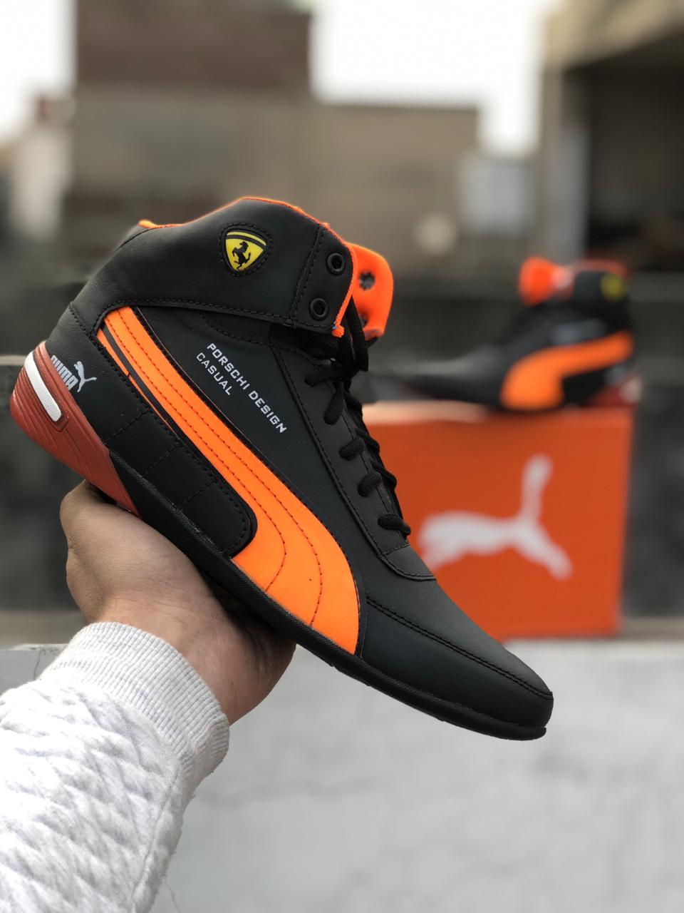 black and orange puma shoes