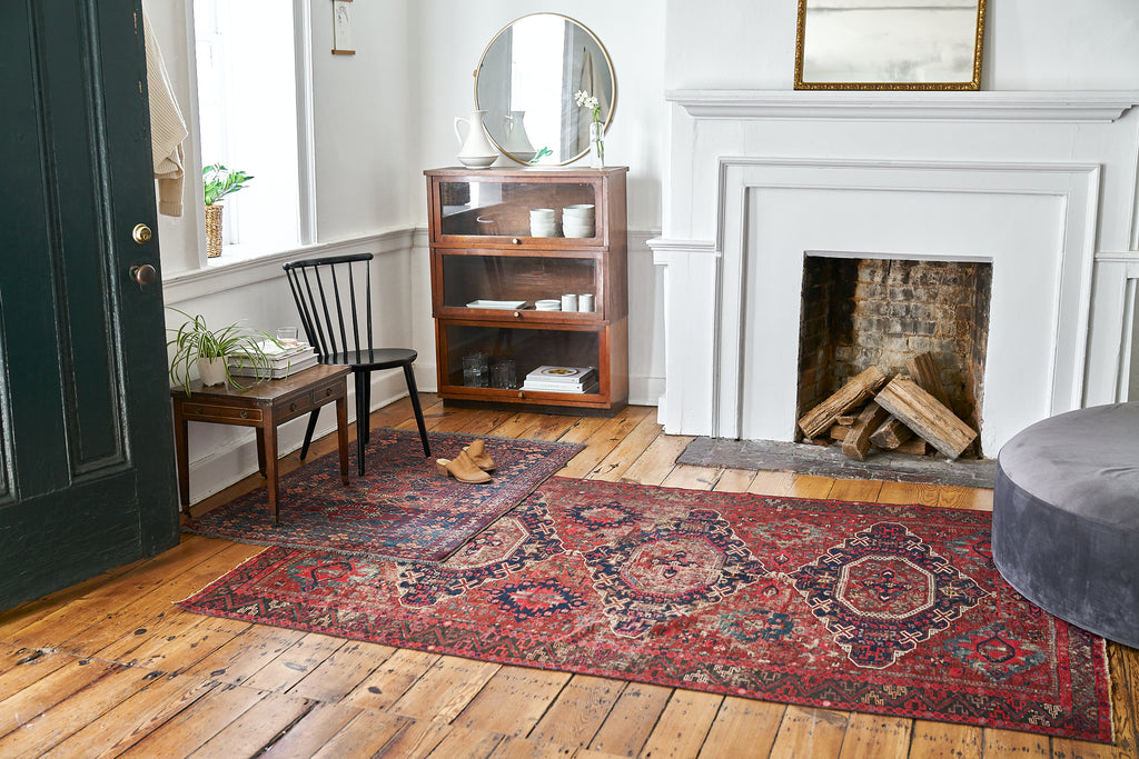 Vintage Persian rugs on an antique pine floor