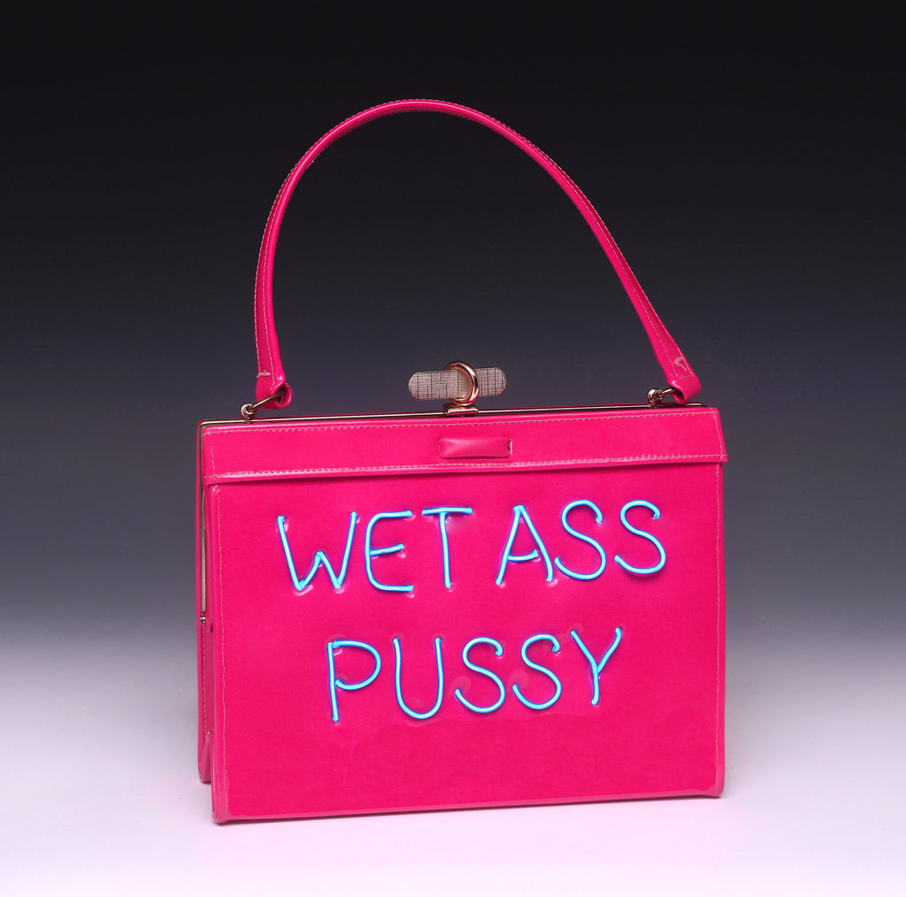 photo of a light up purse that says "Wet Ass Pussy"
