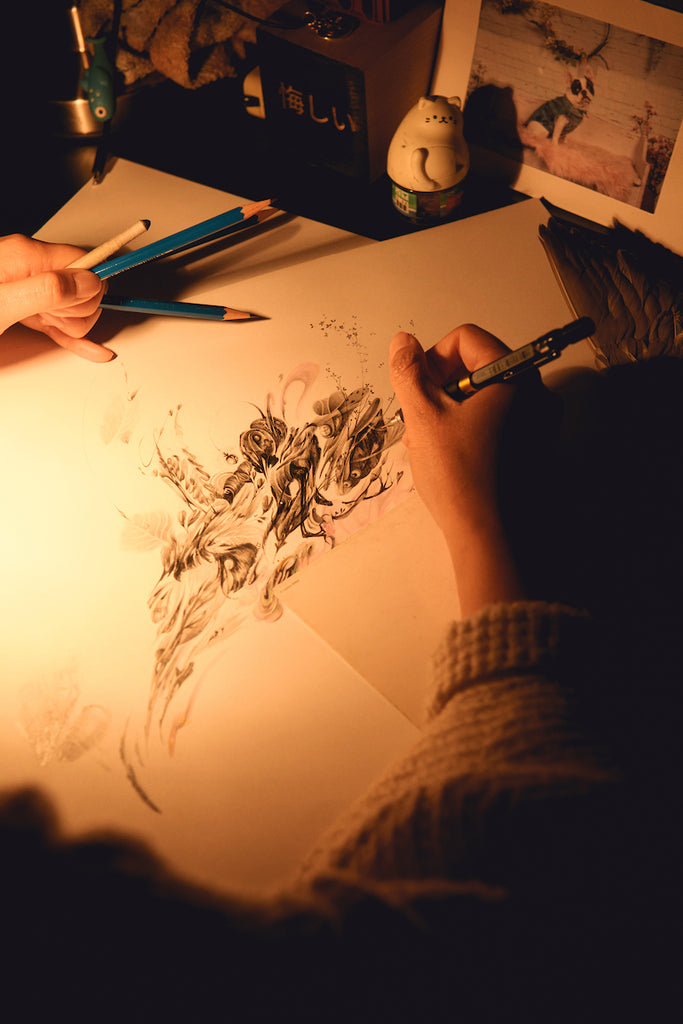 photo of JP Neang drawing in her studio