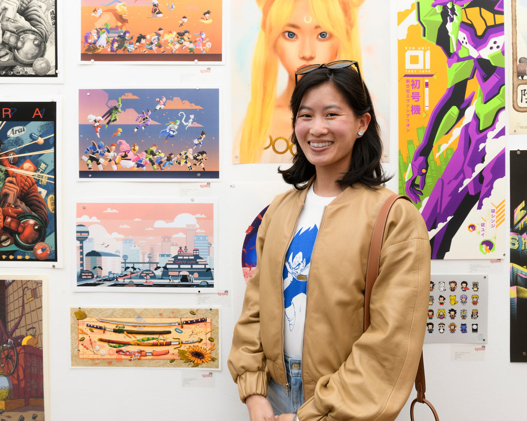 Artist with her work at the opening night of "SUGO A Tribute to Japanese Animation" 