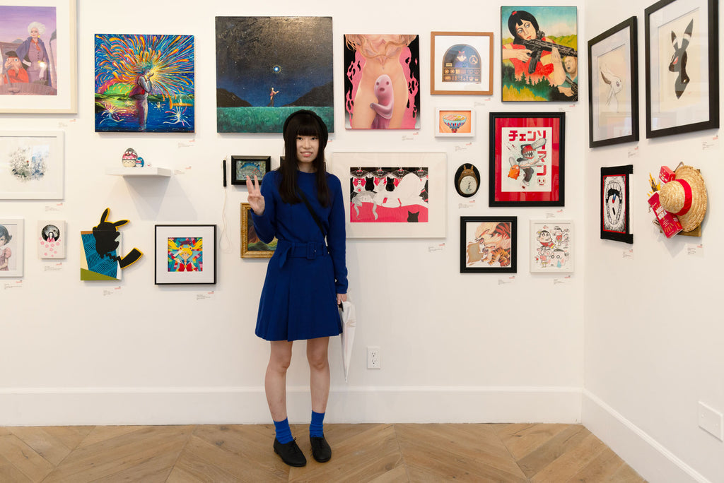 Artist Chiaki Ishimatsu in front of her original Sailor Moon artwork for Anime in LA