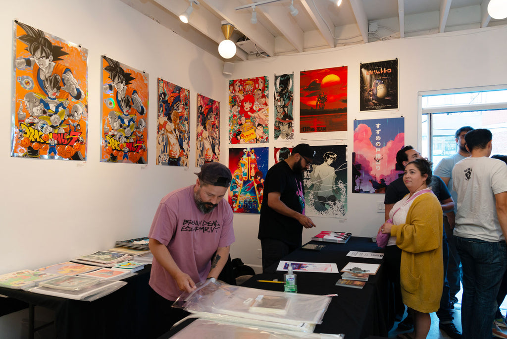 Visitors purchasing prints from Anime in LA