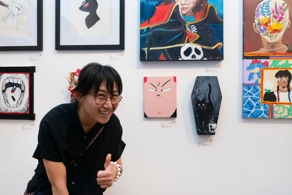 Artist Evah Fan in front of her Anime in LA artwork inspired by Slam Dunk