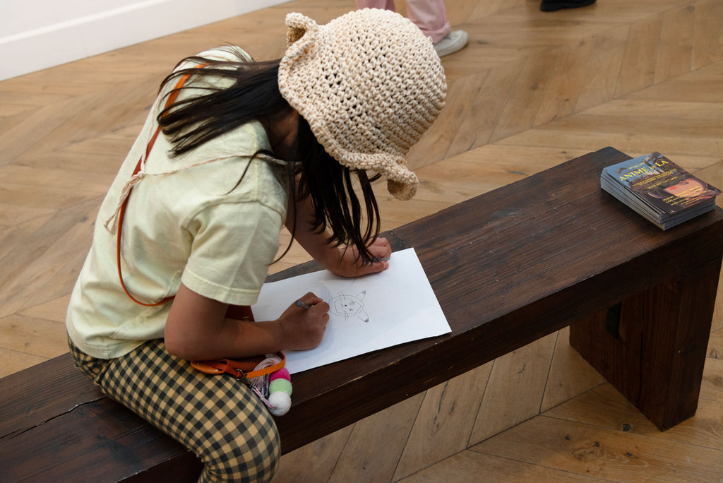 A young visiting artist working on an original Anime creation