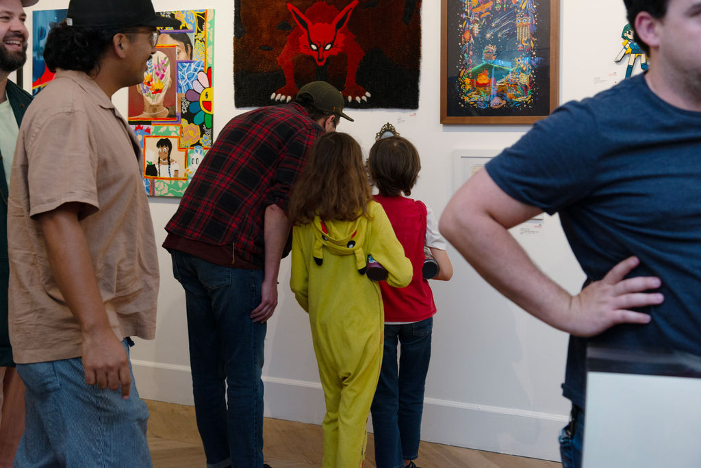 Cosplay Pikachu checking out Jeany Tsao's "Starlight" artwork