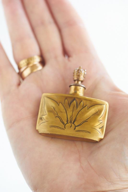 perfume with leaf on bottle