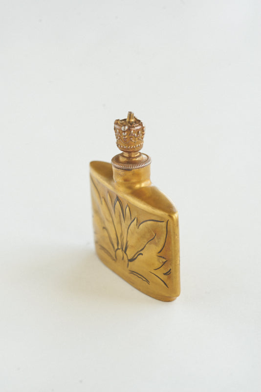 perfume with leaf on bottle