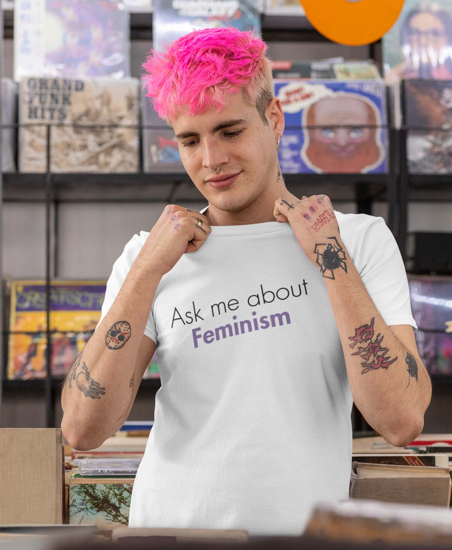 t-shirt-mockup-featuring-a-man-with-pink-hair-at-a-music-store-33311_1600x.jpg