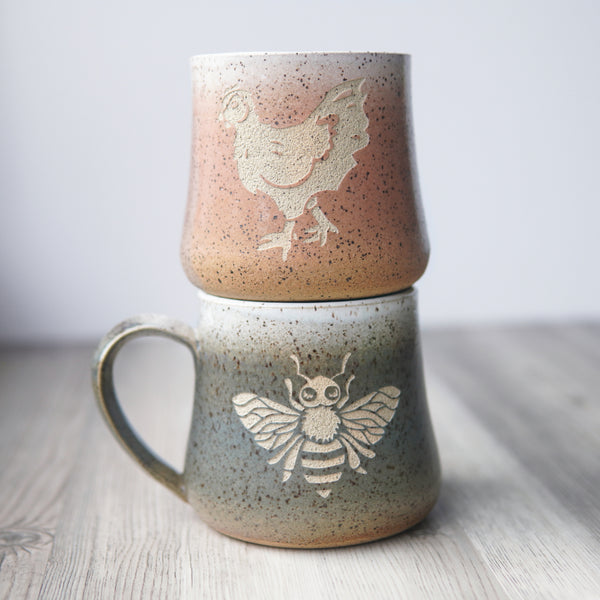 chicken tumbler on top of a bee mug